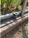 Fixation béton pour une serre de jardin